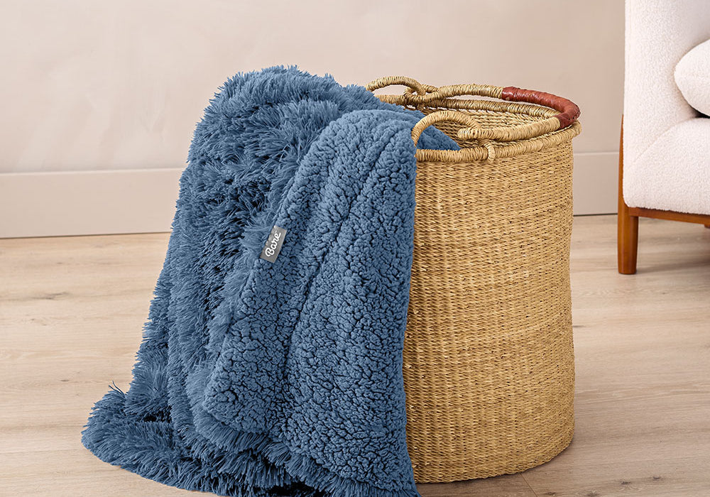 Shaggy Shearling Blue Blanket in a wicket basket