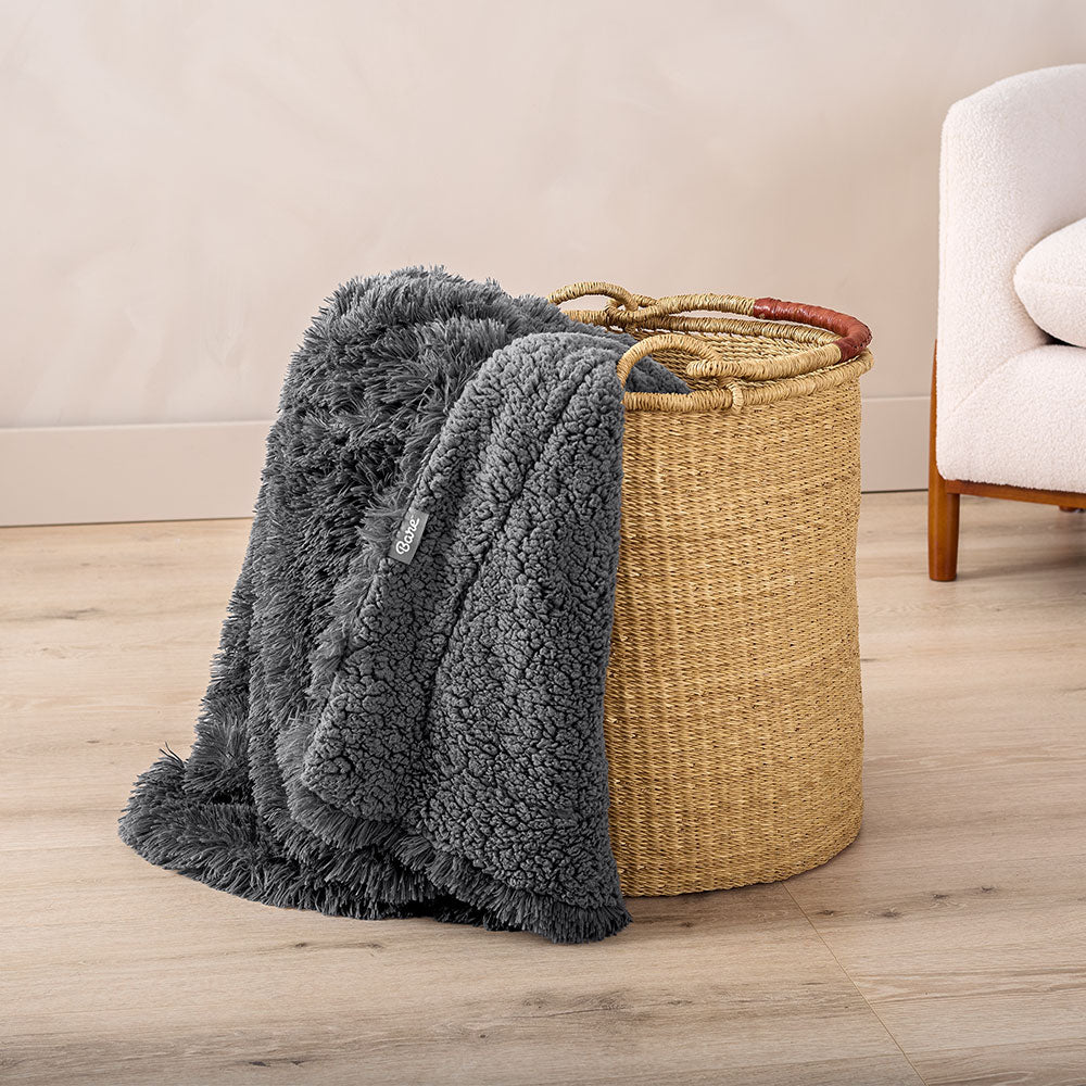 shaggy blanket in clothes basket in room