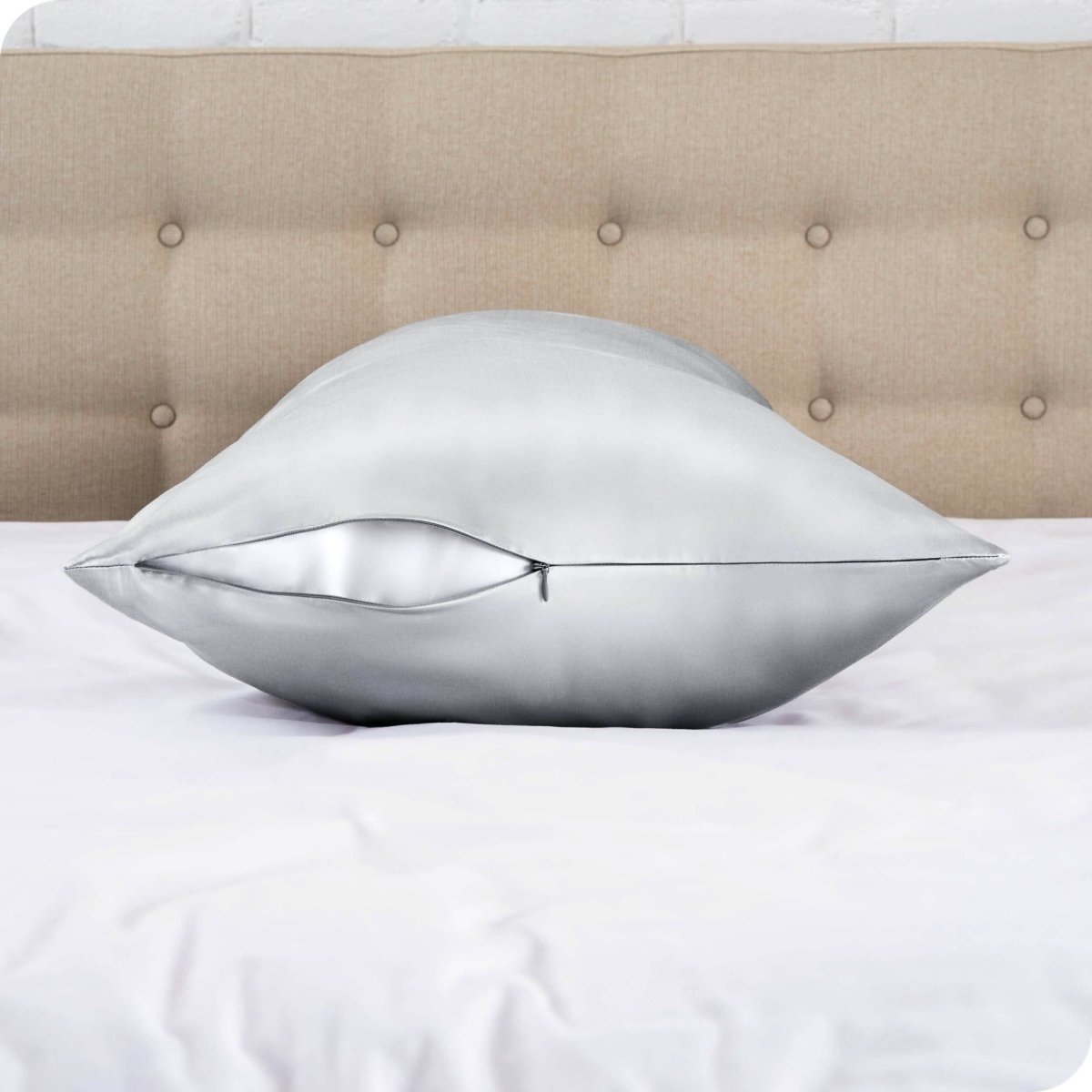 The zipper closure on a silk body pillowcase