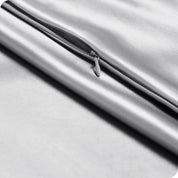 Close up of the zipper on a silk pillowcase