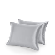 Two satin pillowcases on a white background