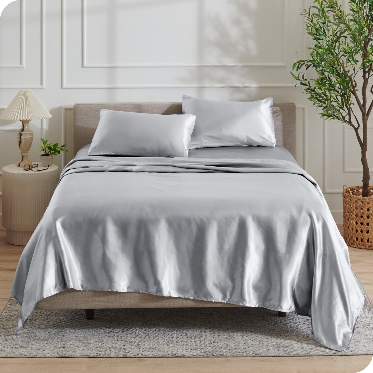 Satin sheets draped over a mattress