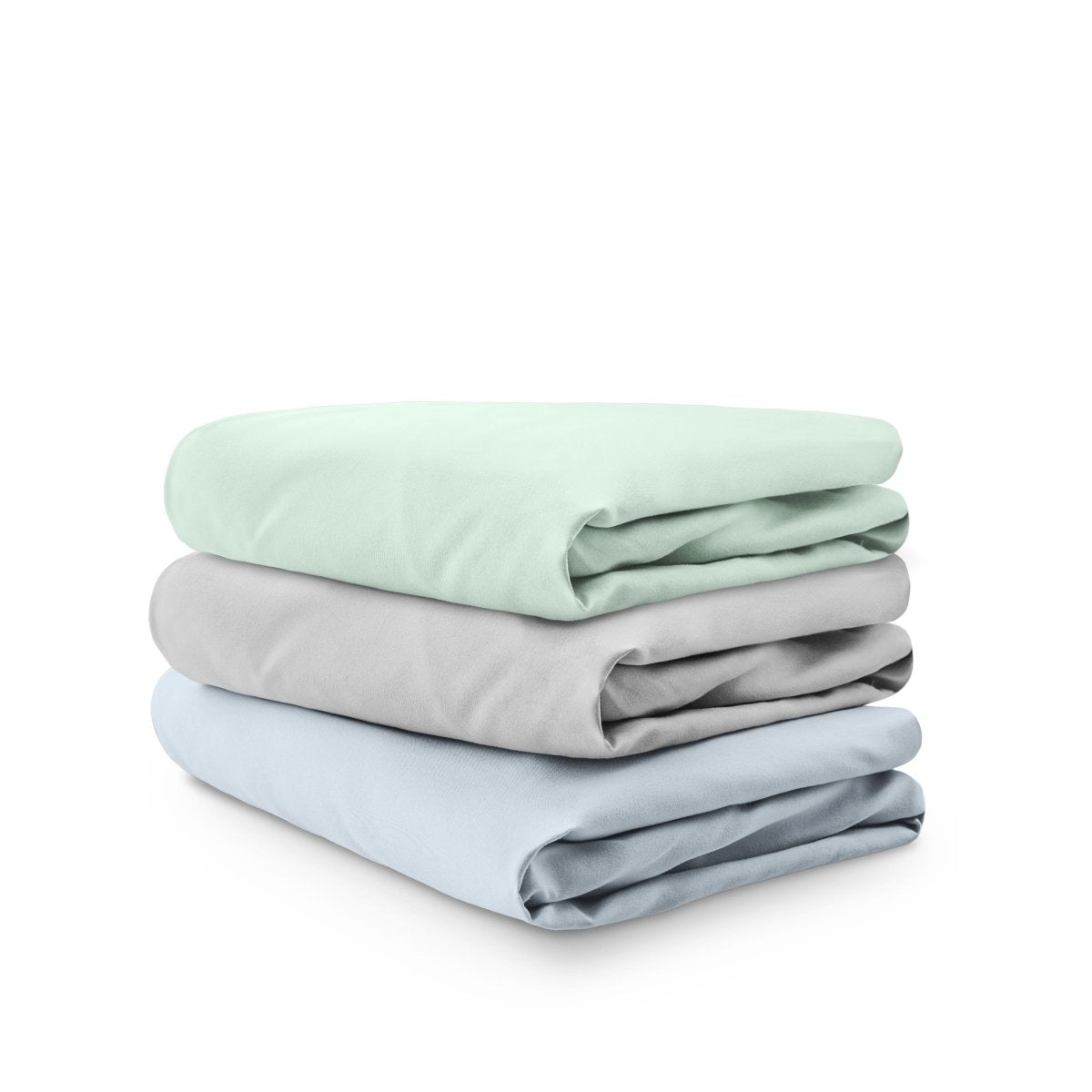 Stack of folded crib sheets on a white background