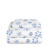 Stack of flannel sheets and pillowcases on a white background