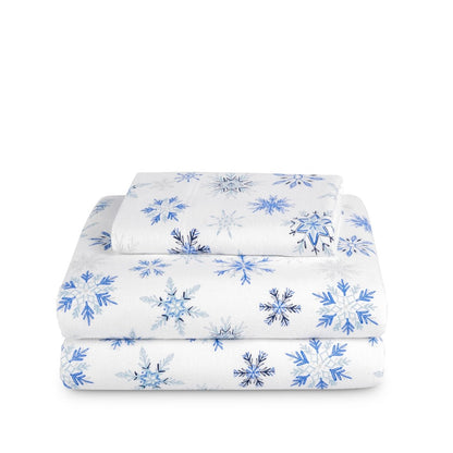 Stack of flannel sheets and pillowcases on a white background