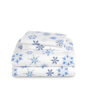 Stack of flannel sheets and pillowcases on a white background