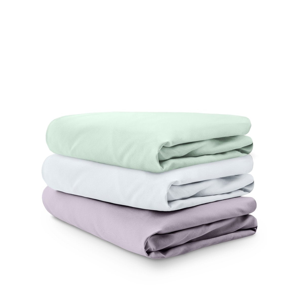 Stack of folded crib sheets on a white background