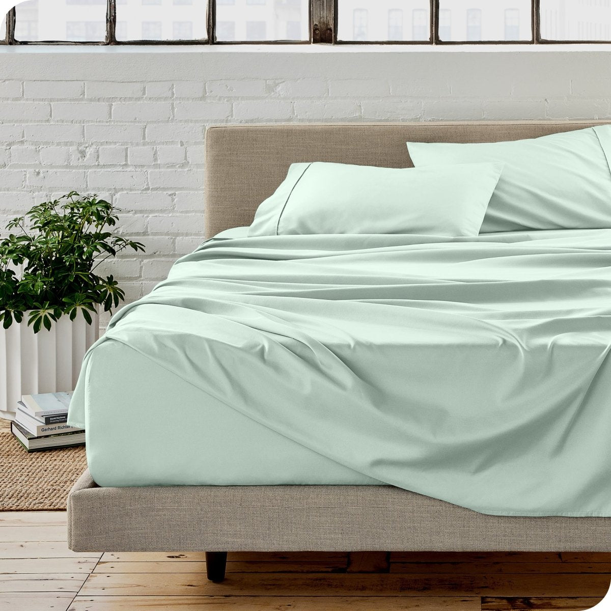 A modern bedroom with microfiber sheets on the mattress