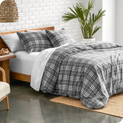 Stirling plaid duvet cover set on a bed in a bright bedroom
