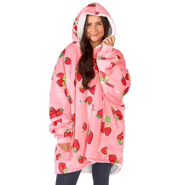 An adult with a sherpa wearable blanket on