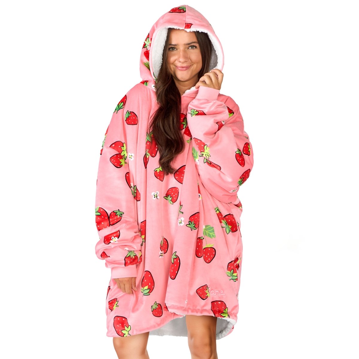 An adult with a sherpa wearable blanket on