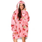 An adult with a sherpa wearable blanket on