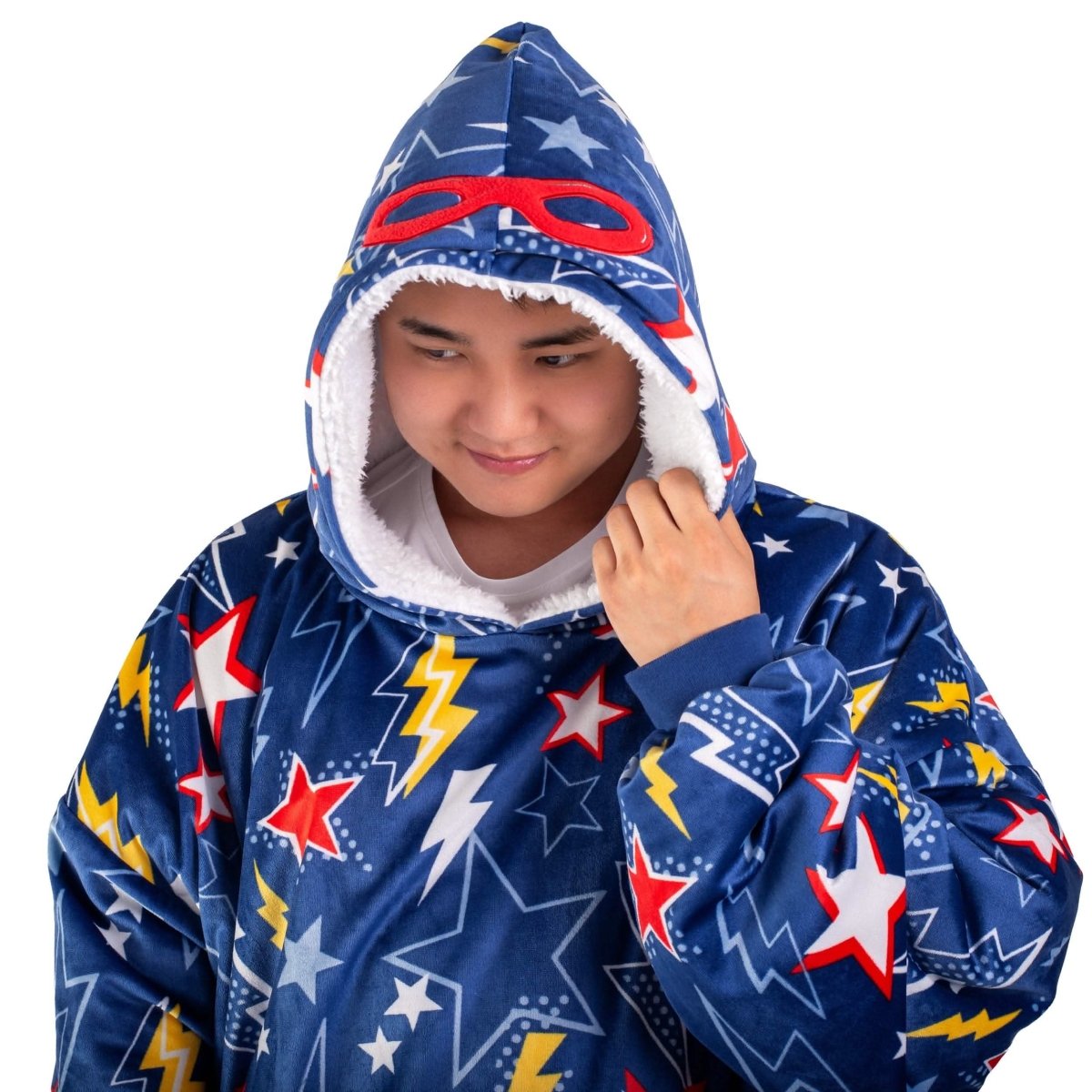 An adult with a sherpa wearable blanket on
