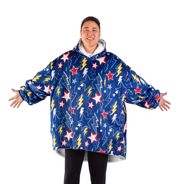An adult with a sherpa wearable blanket on