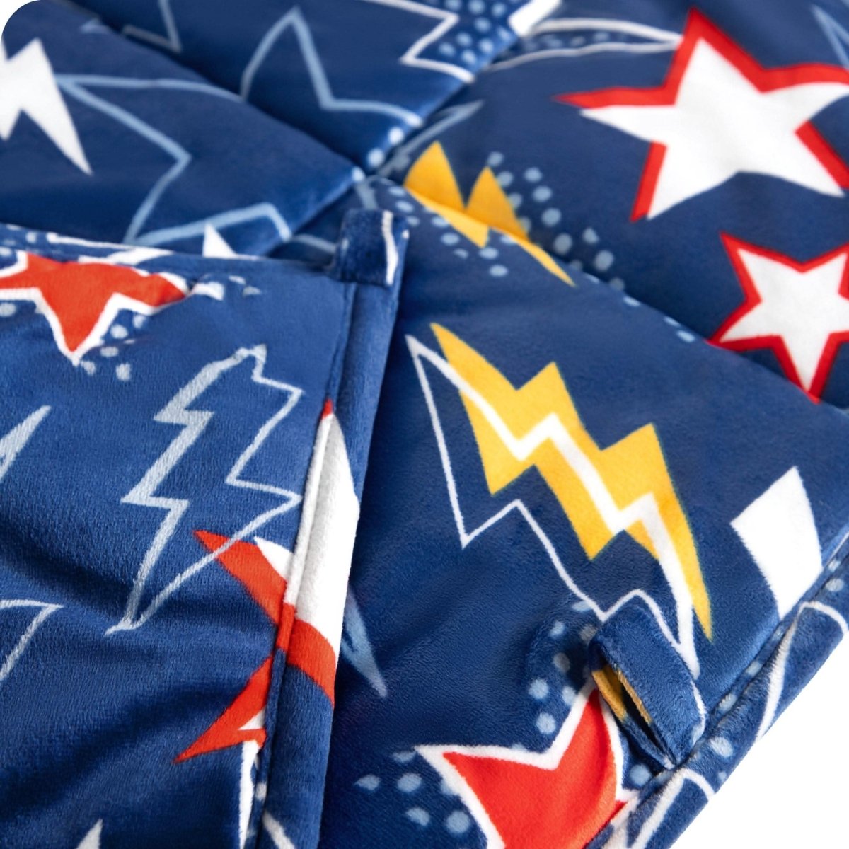 Close-up image of a weighted blanket, featuring detailed stitching and the neatly finished edge of the blanket.