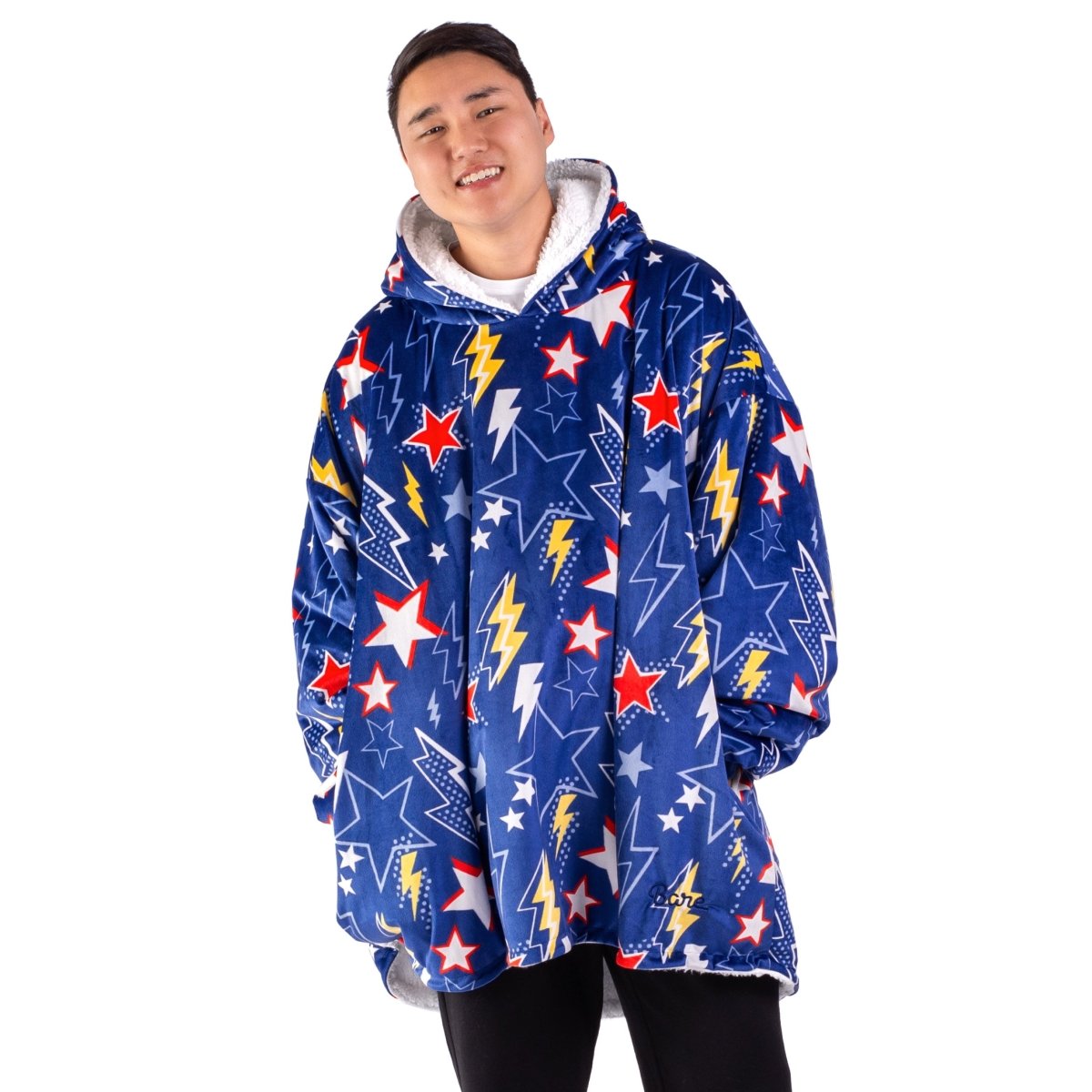 An adult with a sherpa wearable blanket on
