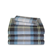 Stack of flannel sheets and pillowcases on a white background
