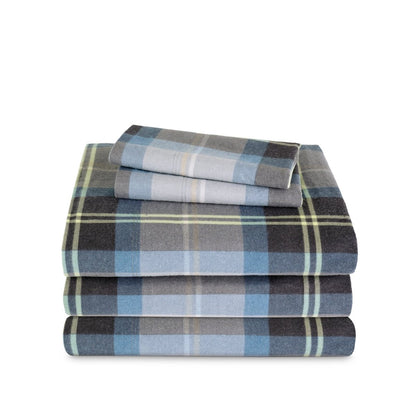 Stack of flannel sheets and pillowcases on a white background