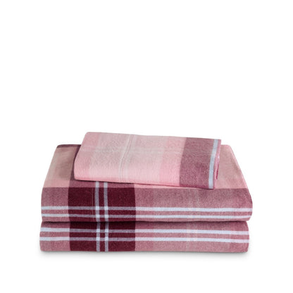 Stack of flannel sheets and pillowcases on a white background