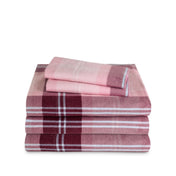 Stack of flannel sheets and pillowcases on a white background