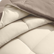 Close up of the comforter folded back showing the two different colored sides