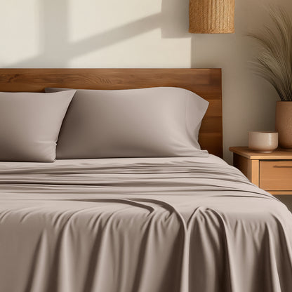 Bamboo sheets on a bed with a wooden headboard