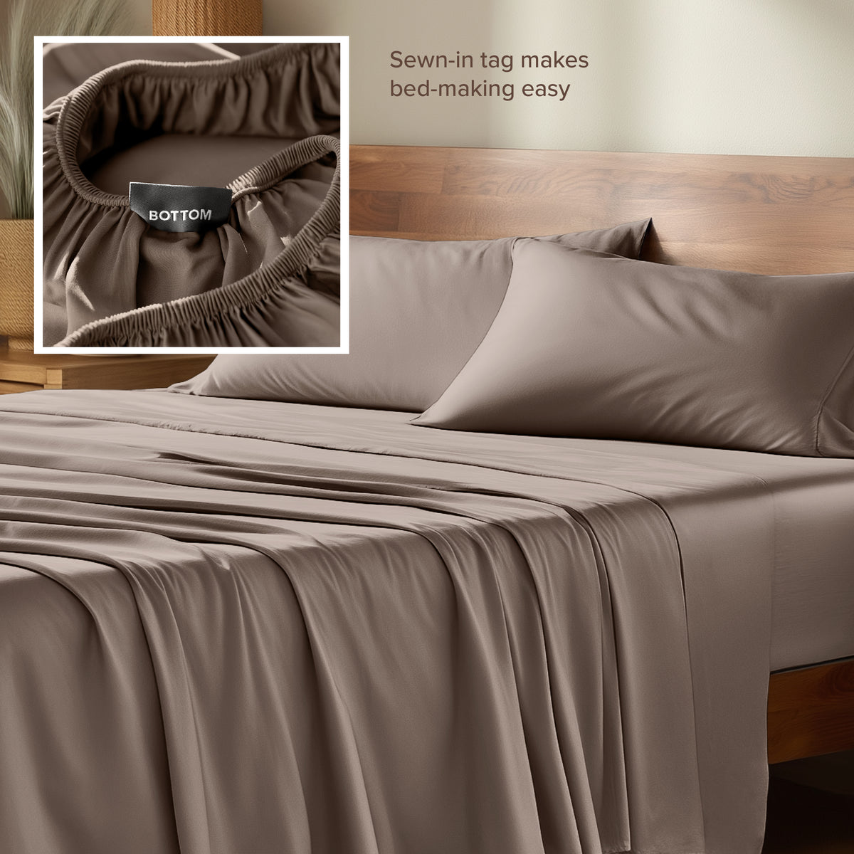 Bamboo sheets with a sewn-in tag on a wooden bed frame.
