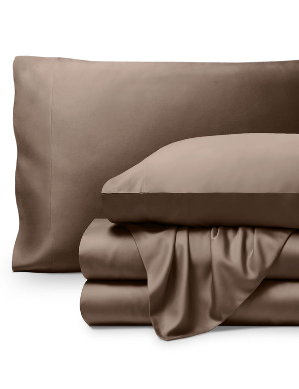 Bamboo pillowcases and sheets set on a white background