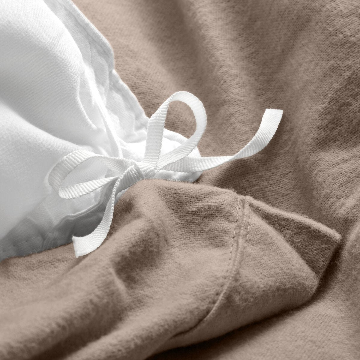 Close-up of the ties on a flannel duvet cover