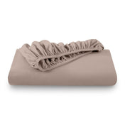 A folded flannel cotton fitted sheet in a white background