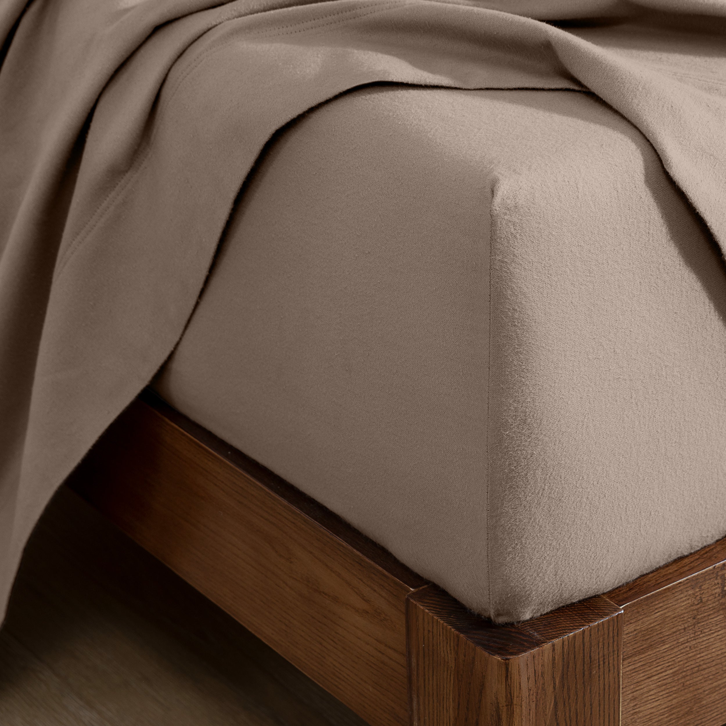 Flannel fitted sheet on a wooden bed frame