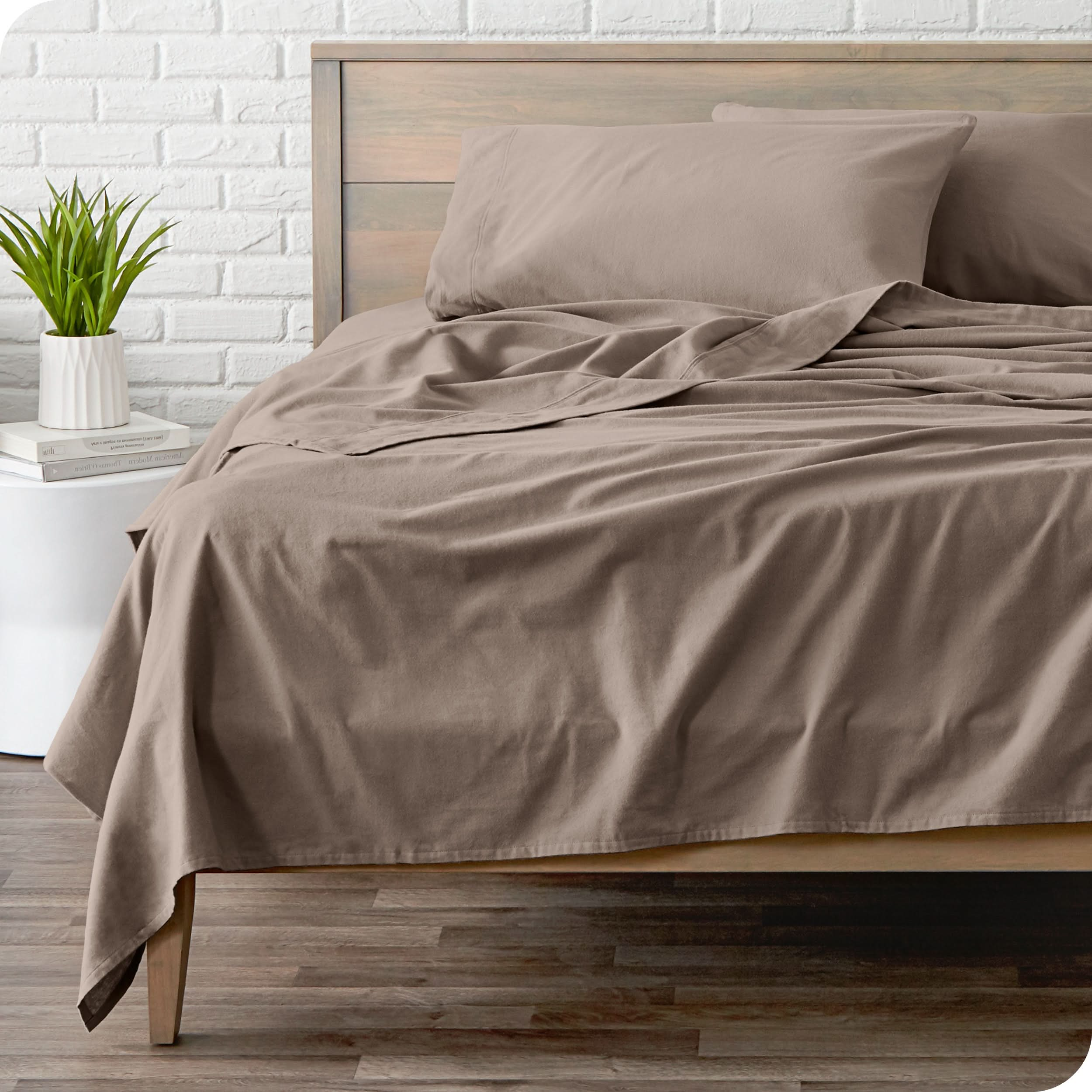 A modern bed with a flannel sheet set on