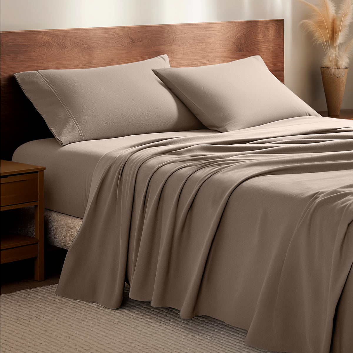 Flannel bedding set on a bed with a wooden headboard and side table