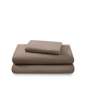 Cotton flannel sheet set folded and stacked on a white background