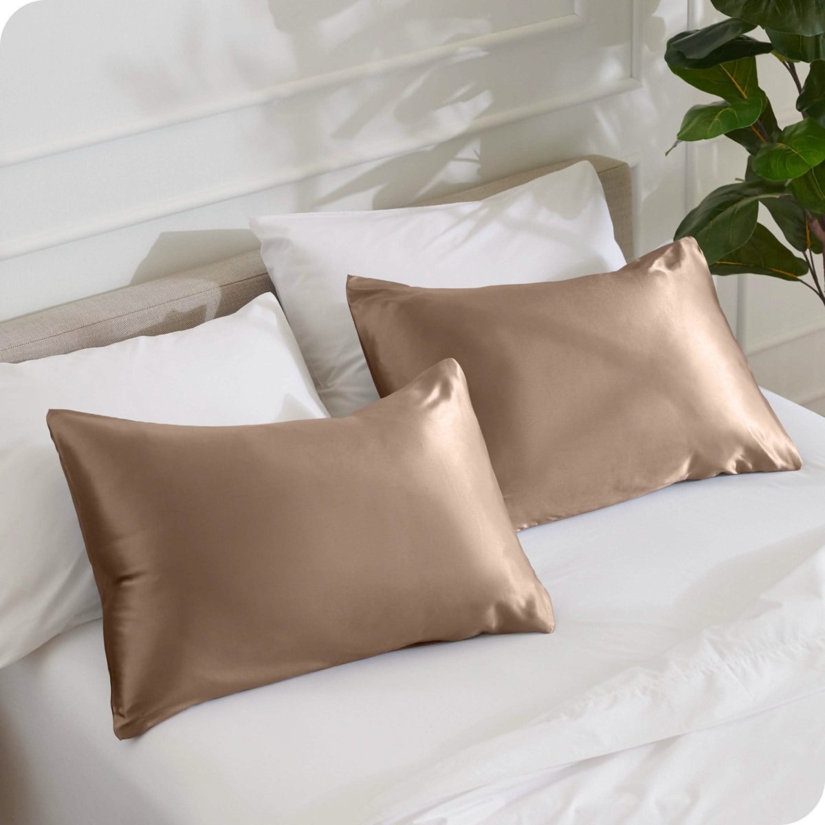 2 mulberry silk pillowcases on pillows set on a bed