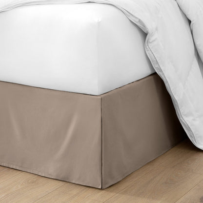 Ultra soft bed skirt on a bed with white bedding.