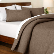 A comforter set on a bed