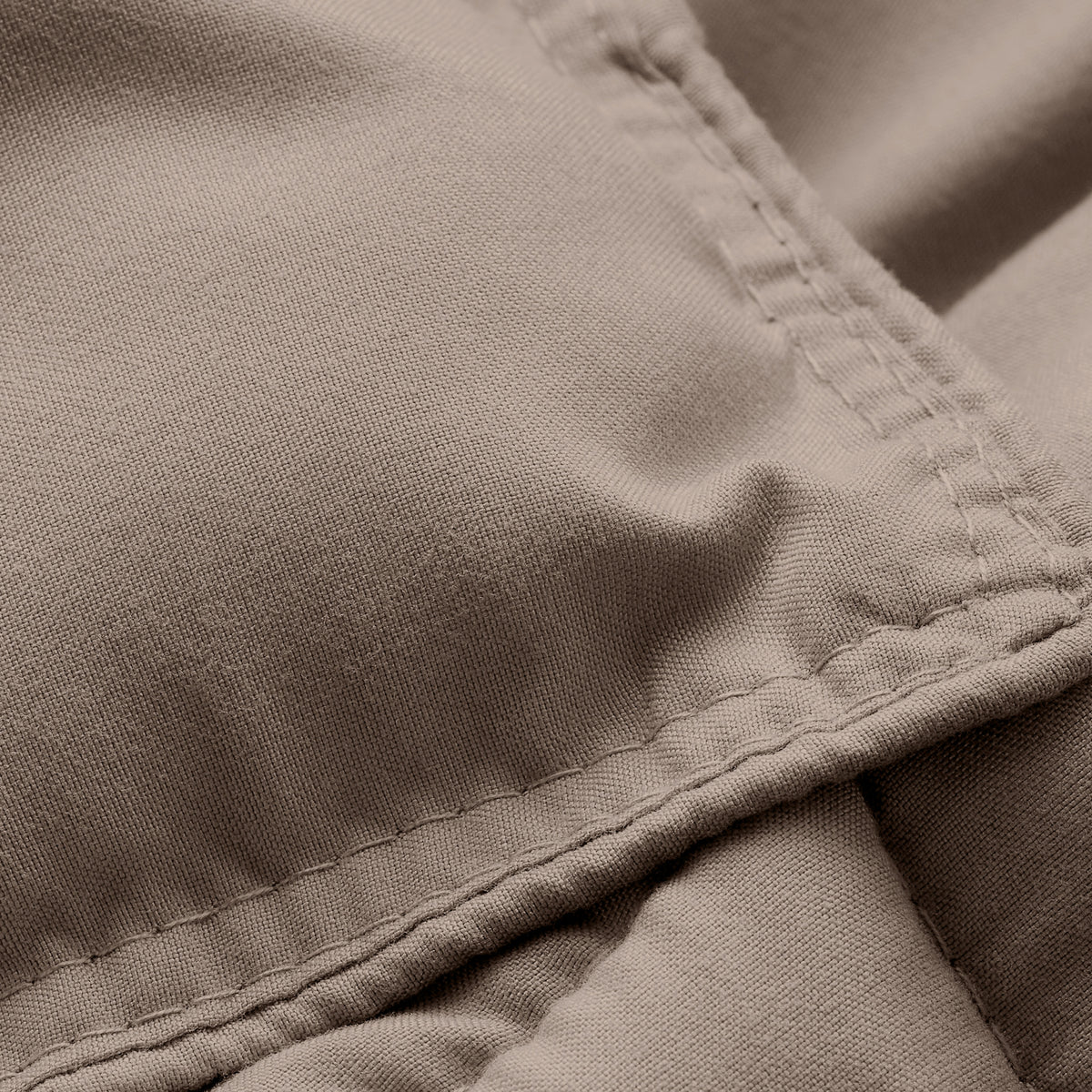 Close-up of comforter fabric with stitching detail