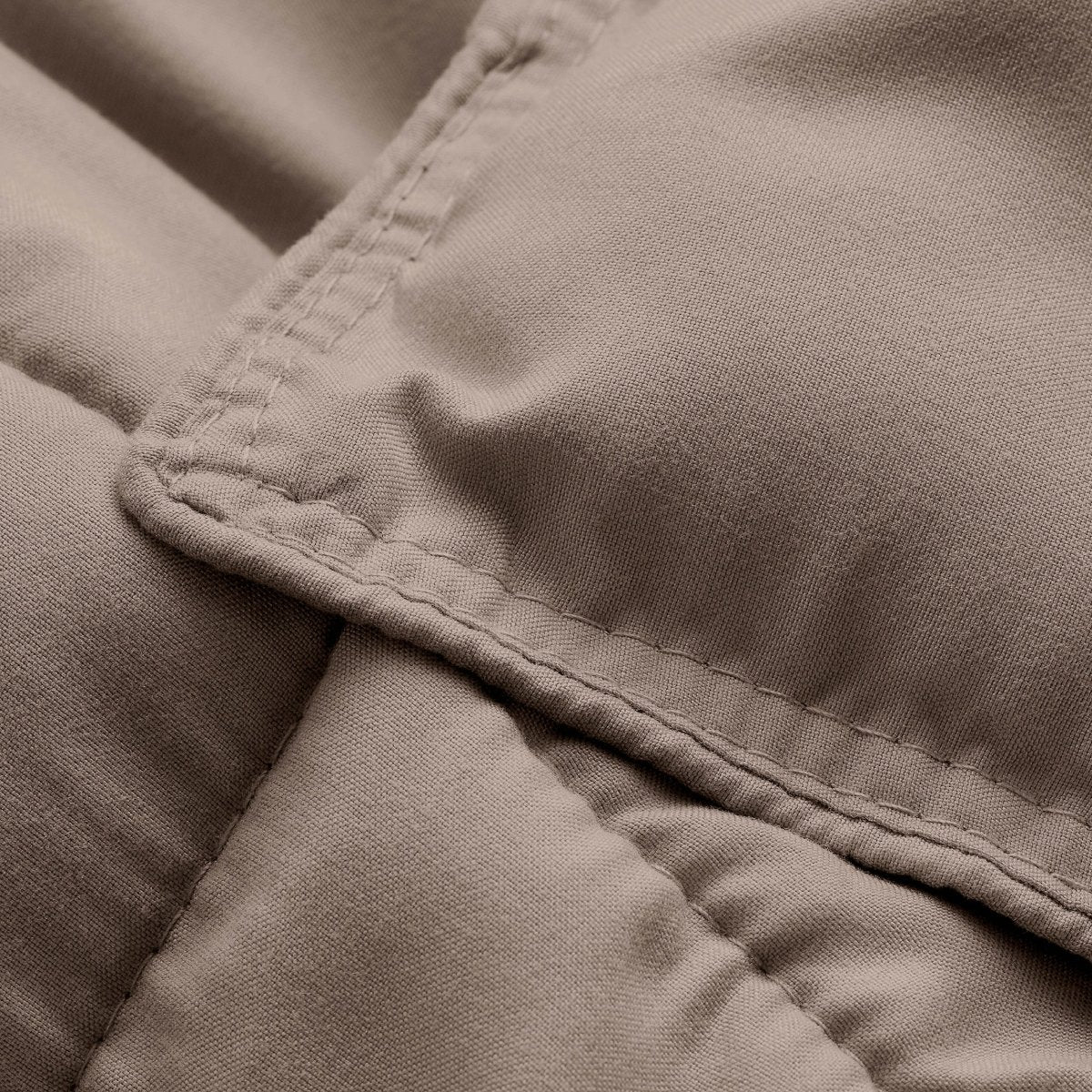 Close-up of comforter fabric with stitching detail