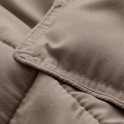 Close-up of comforter fabric with stitching detail