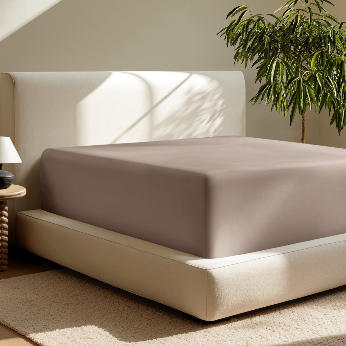 A deep pocket fitted sheet on a mattress