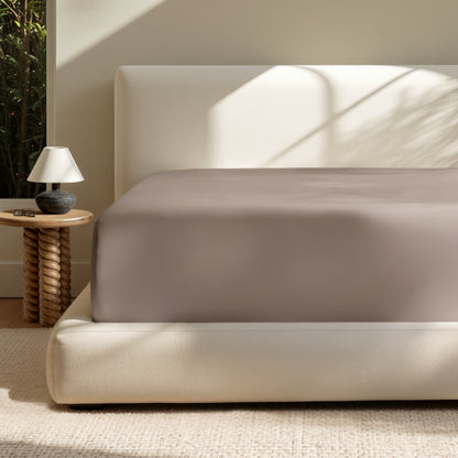 A deep pocket mattress with a fitted sheet on it