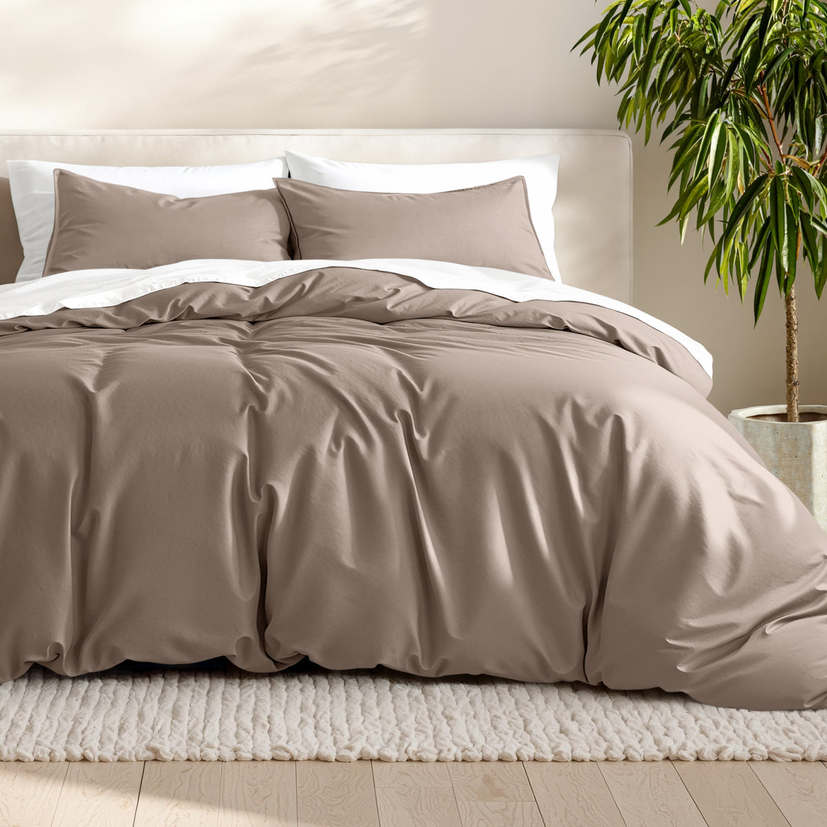 Microfiber bedding set on a bed with a neutral background