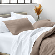 Close up of pillow shams on a bed