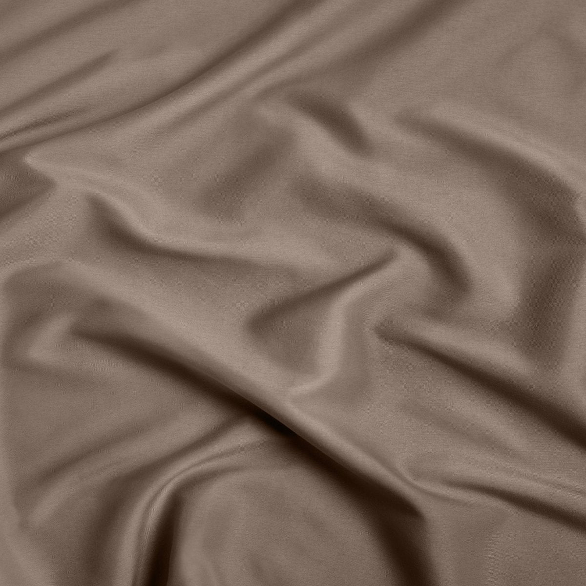 A close-up of ultra soft sheet fabric with soft folds and a smooth texture