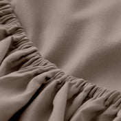 A close-up of a fitted sheet with elasticized edge.