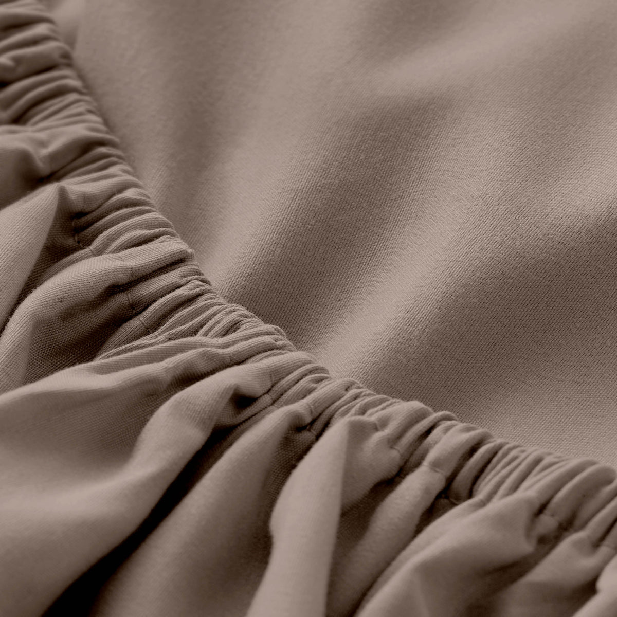Close-up of fitted sheet with all around elastic