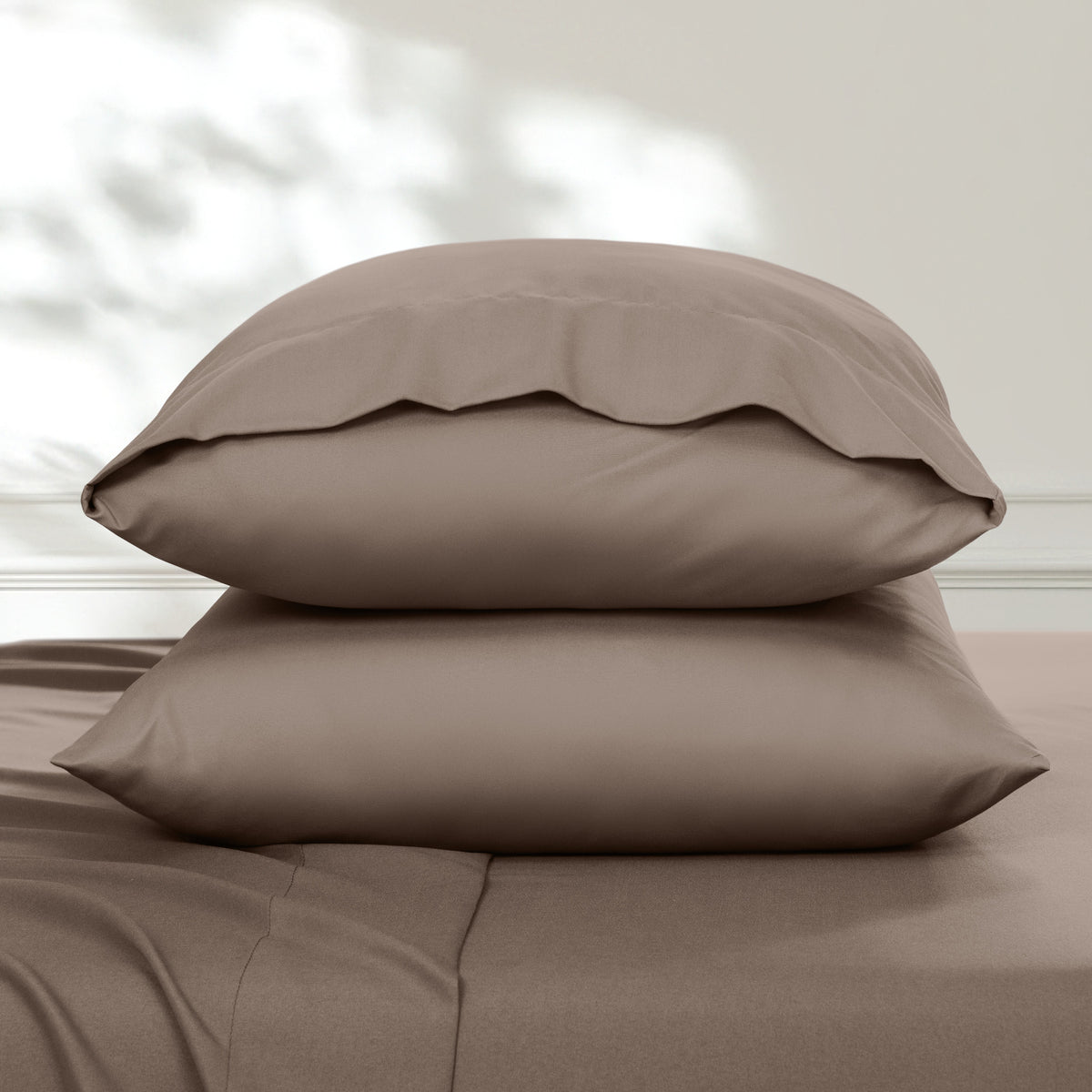 2 pillowcases on pillows