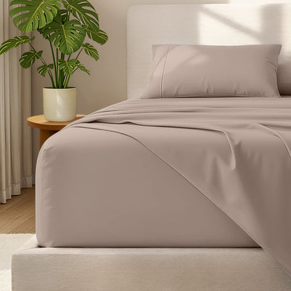 Bed with microfiber bedding and wooden headboard in a bedroom setting
