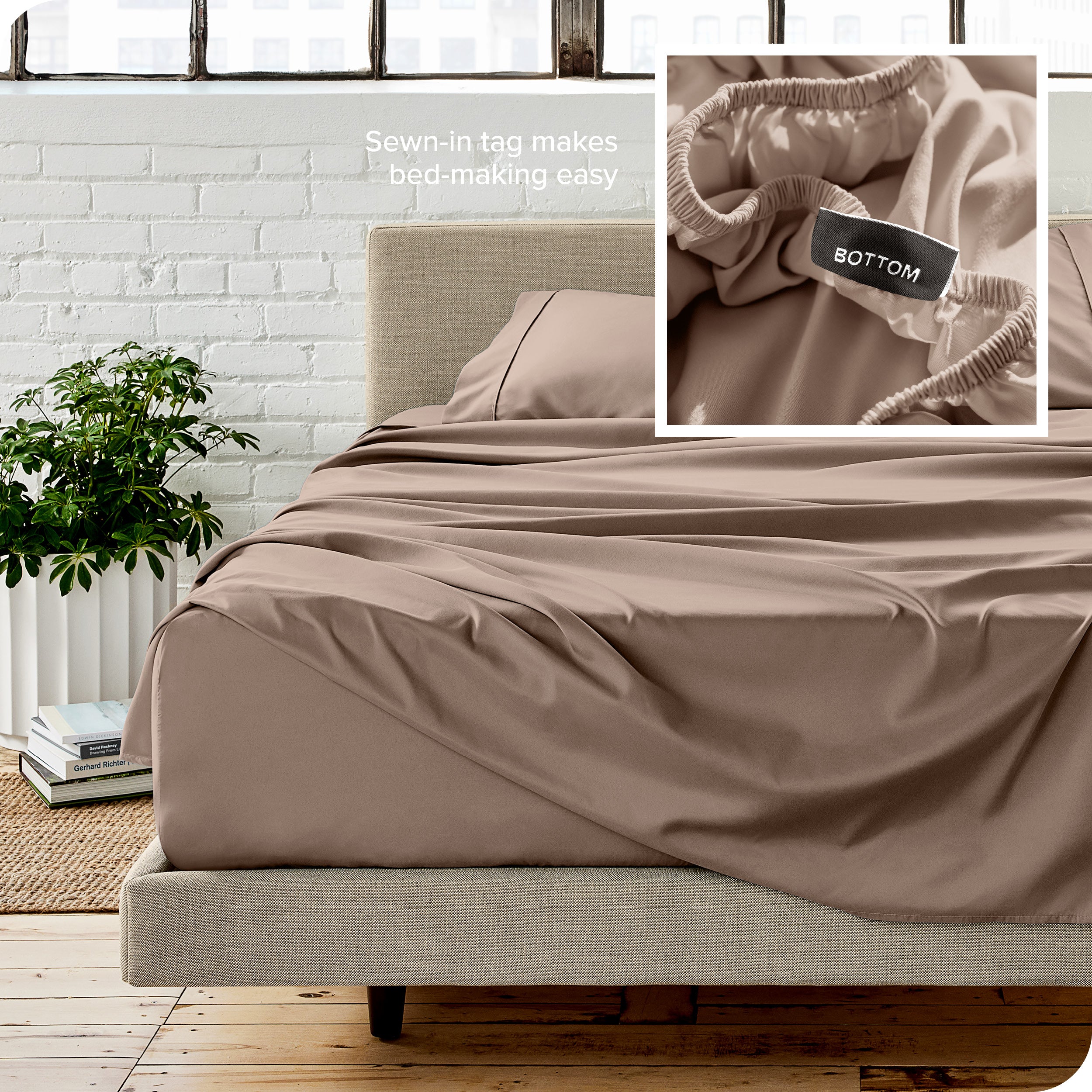 Close up of sewn in tag and matching sheets on a bed